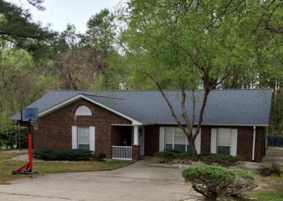 Brick ranch home in Louisburg, NC with a new gray architectural shingle roof.
