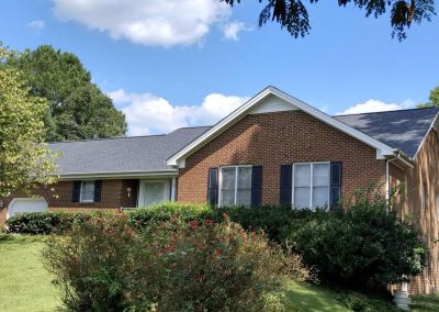 Brick ranch home in Youngsville, NC with a new dark gray architectural shingle roof.